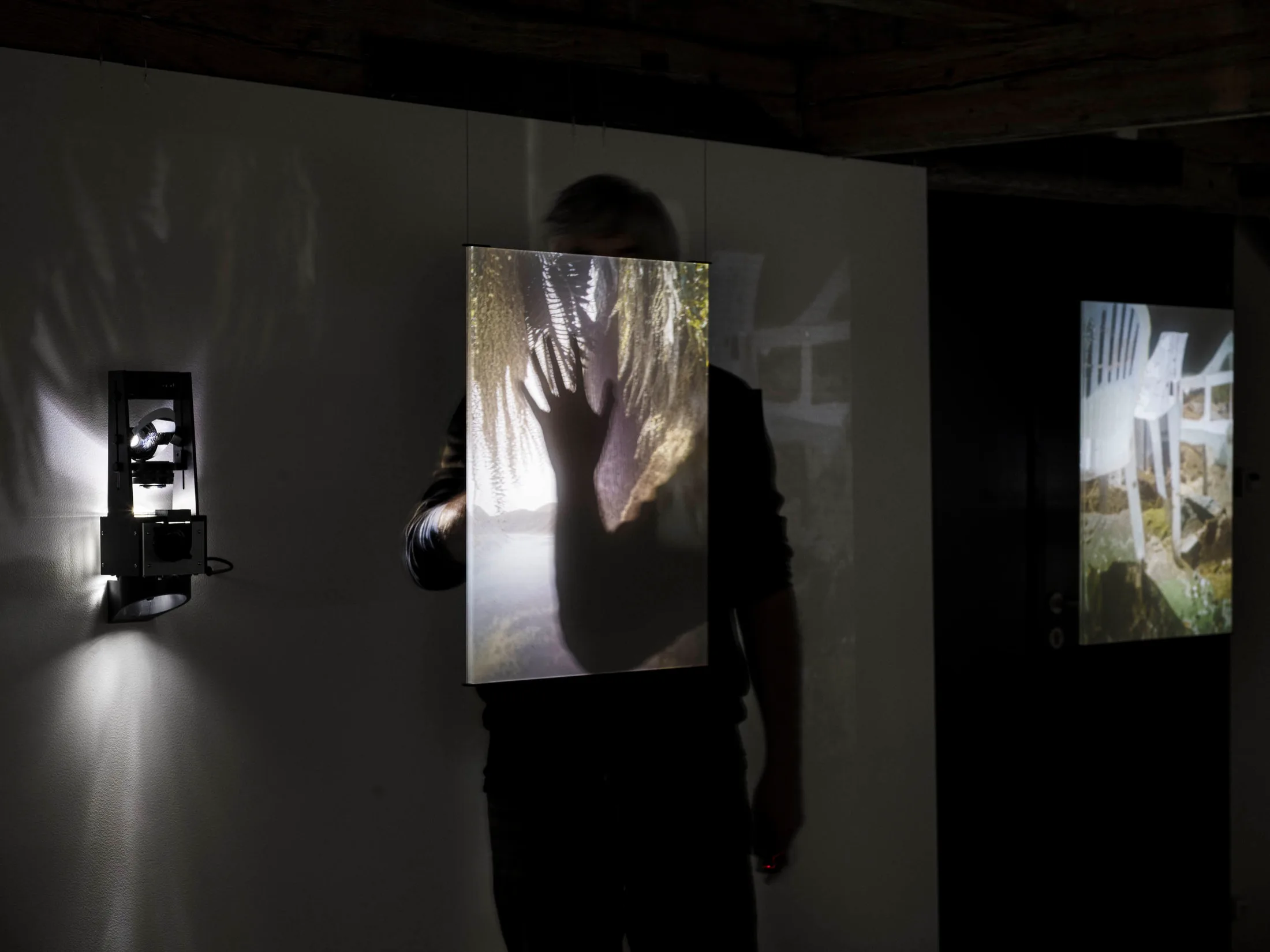 A visitor behind one of the plexiglass screens
